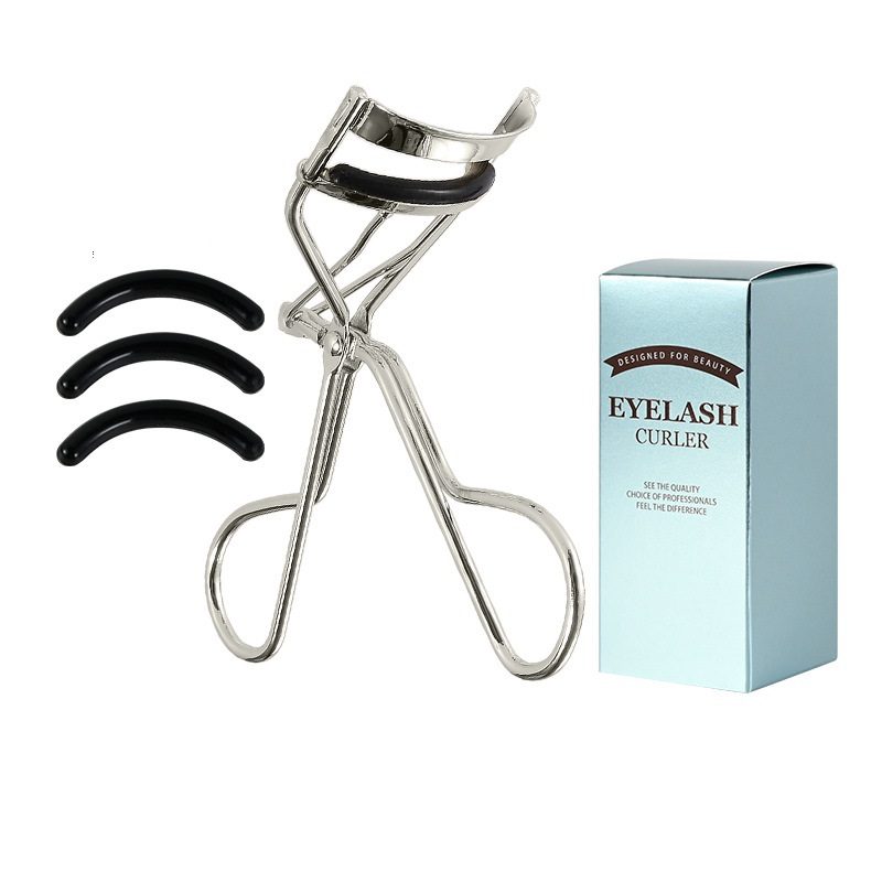 Close-up of eyelash curler gripping natural lashes gently